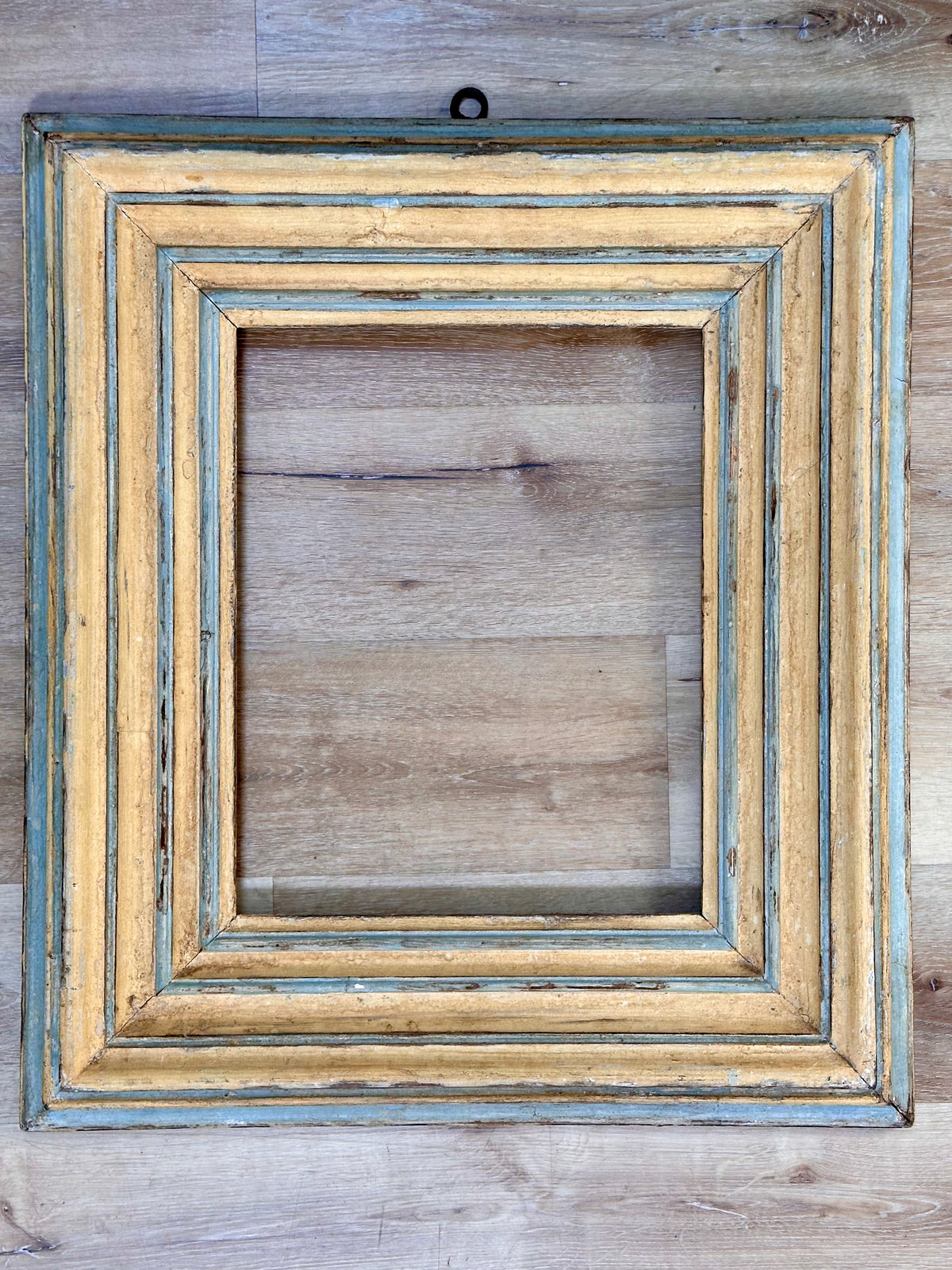 Italian 18th Century carved, stepped frame having original pale blue and yellow polychrome